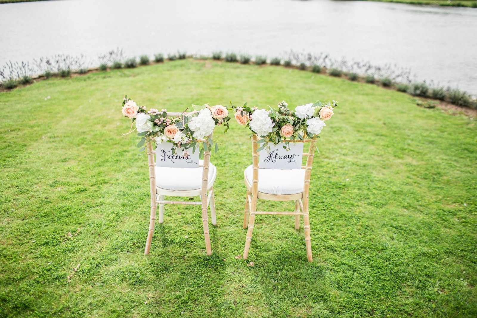 Mr and Mrs chairs on a lawn at a Grande Prairie wedding